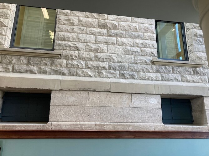This is the exterior wall of the jail as seen from the lower level of the library in the adult services area. 