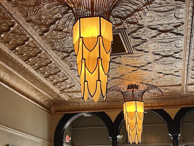 The tin ceiling and special chandeliers add visual interest and history to Berry's.