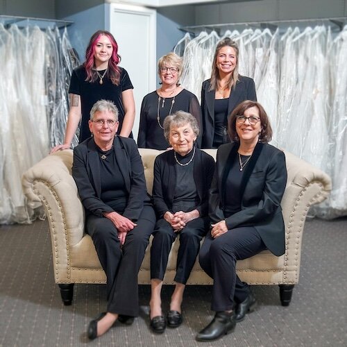 The staff of Brides World includes (seated) Kim Witmer, Nancy Rossi, DeAnn Mckillips (standing) Mackenzie Schulte, Wendy Lehman, and Desiree Gonzales.