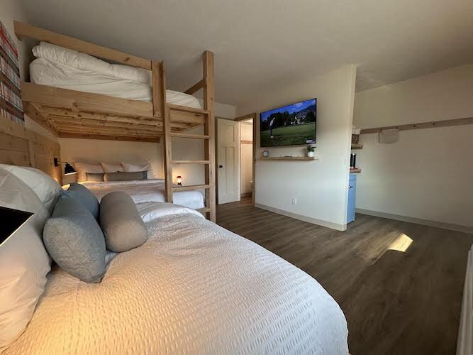 One of the 25 units features handcrafted knotty alder wood beds and bunkbeds.