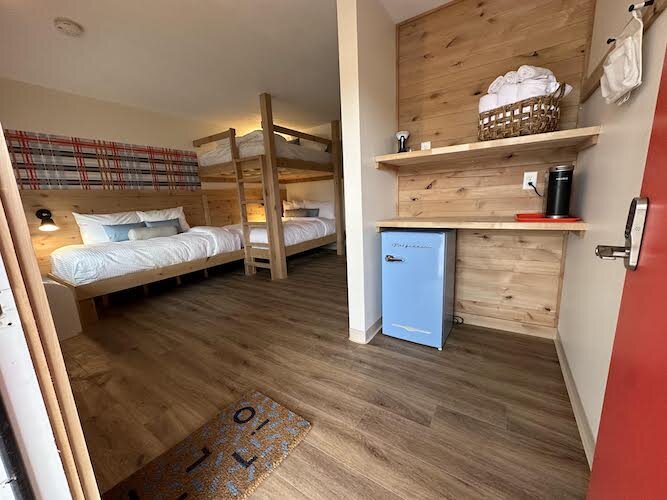 One of the 25 units features handcrafted knotty alder wood beds and bunkbeds.