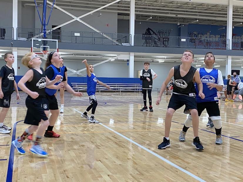 Youth basketball teams fill the courts at Cedar Point Sports Center.