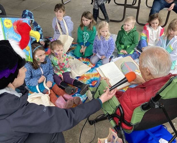 Children listen to an earth-themed book during a previous Earth Day event at Osborn Park.