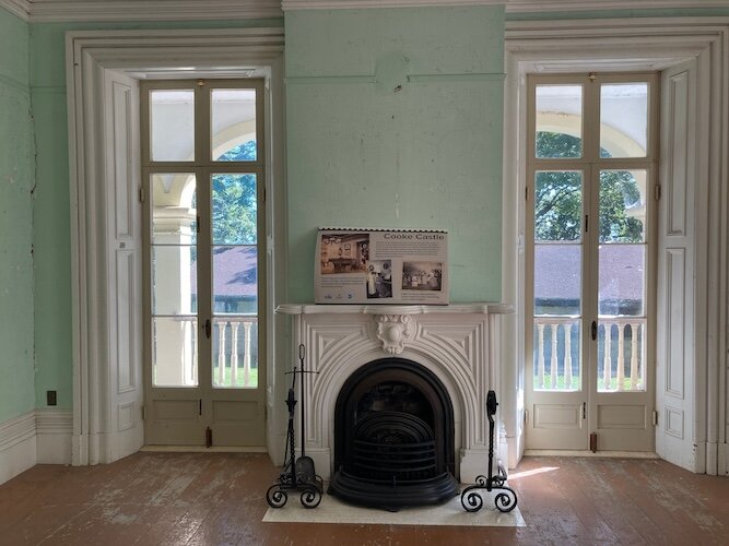 The fireplace is still in great shape in this first-floor room of Cooke Castle, the summer home of banker Jay Cooke. 