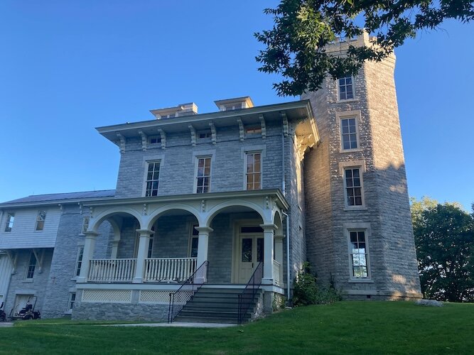 This side view of Cooke Castle shows the sprawling porch. 