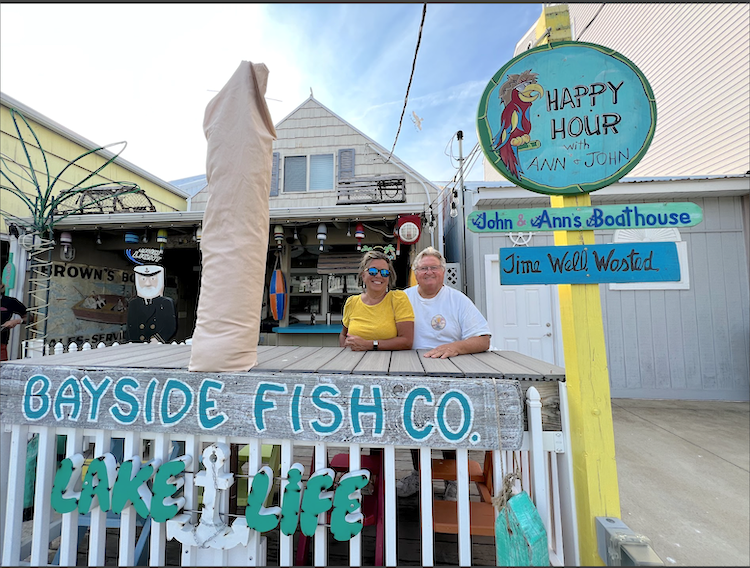 John and Ann Arnold enjoy spending time with friends and family at their boathouse on Curran Street.