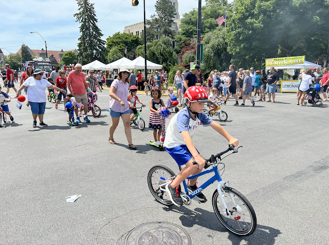 Children participate in the 2022 July 4 bike parade.