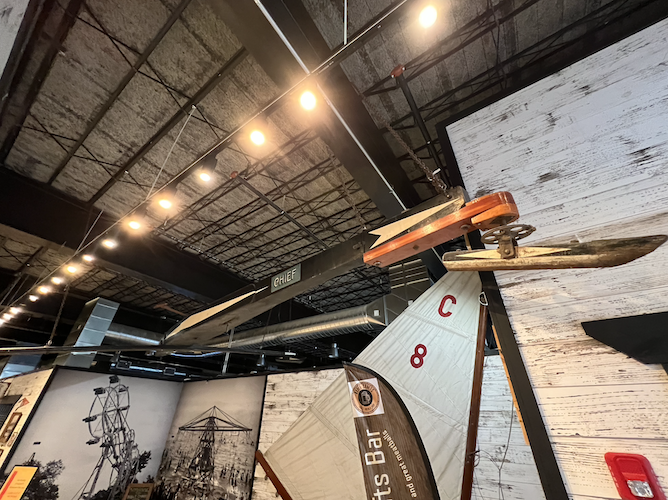 The Chief, a Sandusky-made boat that traveled across the ice in the 1950s, hangs near one of the entrances to the Marketplace.