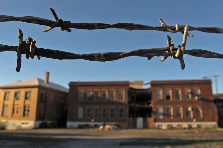 Barbed wire kept people off of the American Crayon factory prior to its demolition.
