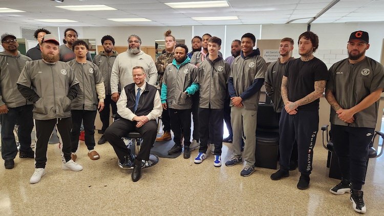 Instructors Phil Parker, Sr. and Phil Parker, Jr. and students in the inaugural SCC Barber Program pose with Sandusky City Schools superintendent and CEO Dan Rambler (seated)