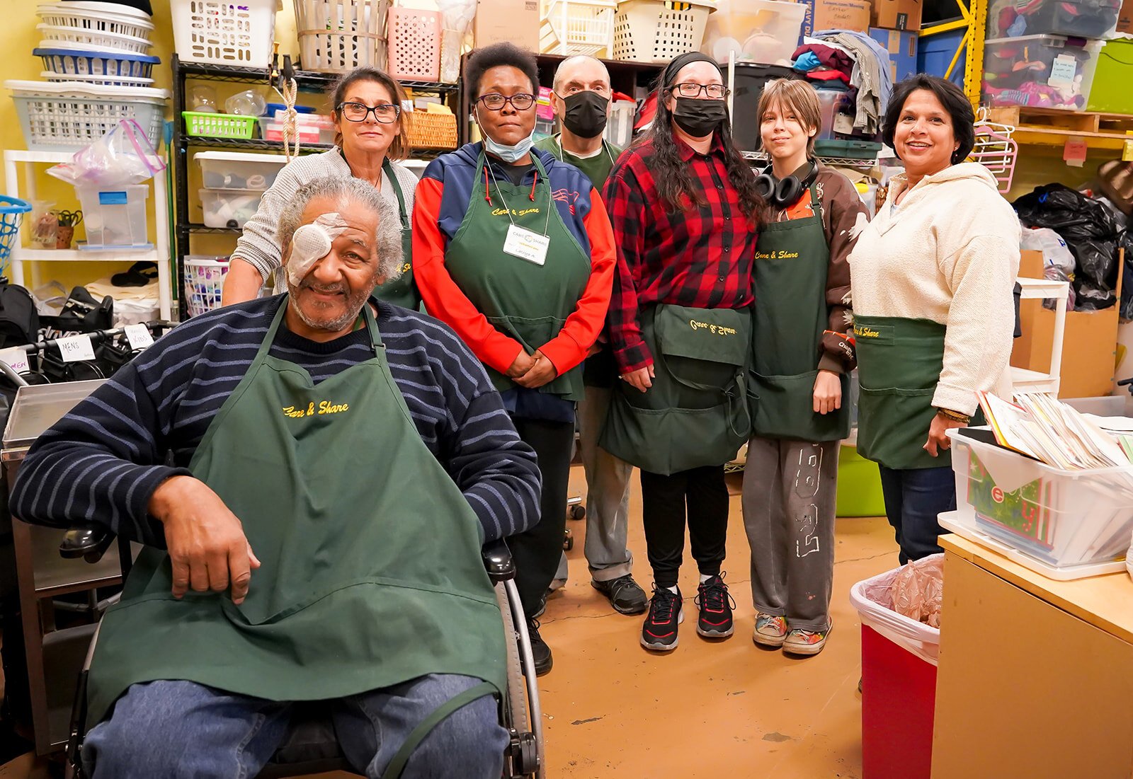 Kromer poses with members of the Care & Share team. 