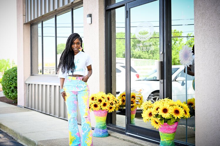 Edy Harlan stands outside of her business The Garden of Edy.