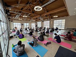 Members of the community enjoy yoga Nov. 1 at the Mylander Pavilion.