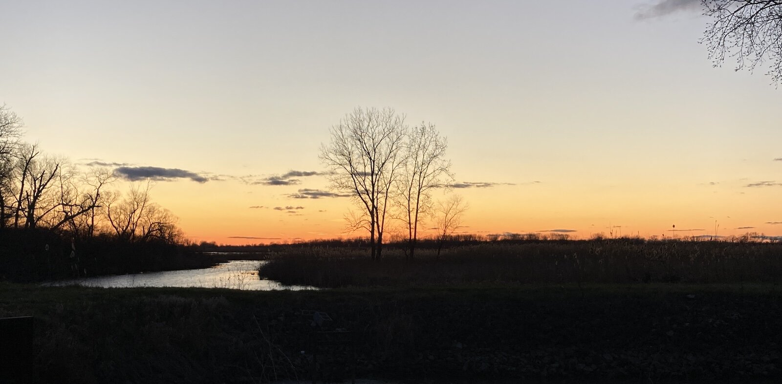 The sun sets over the marsh at Winous Point.