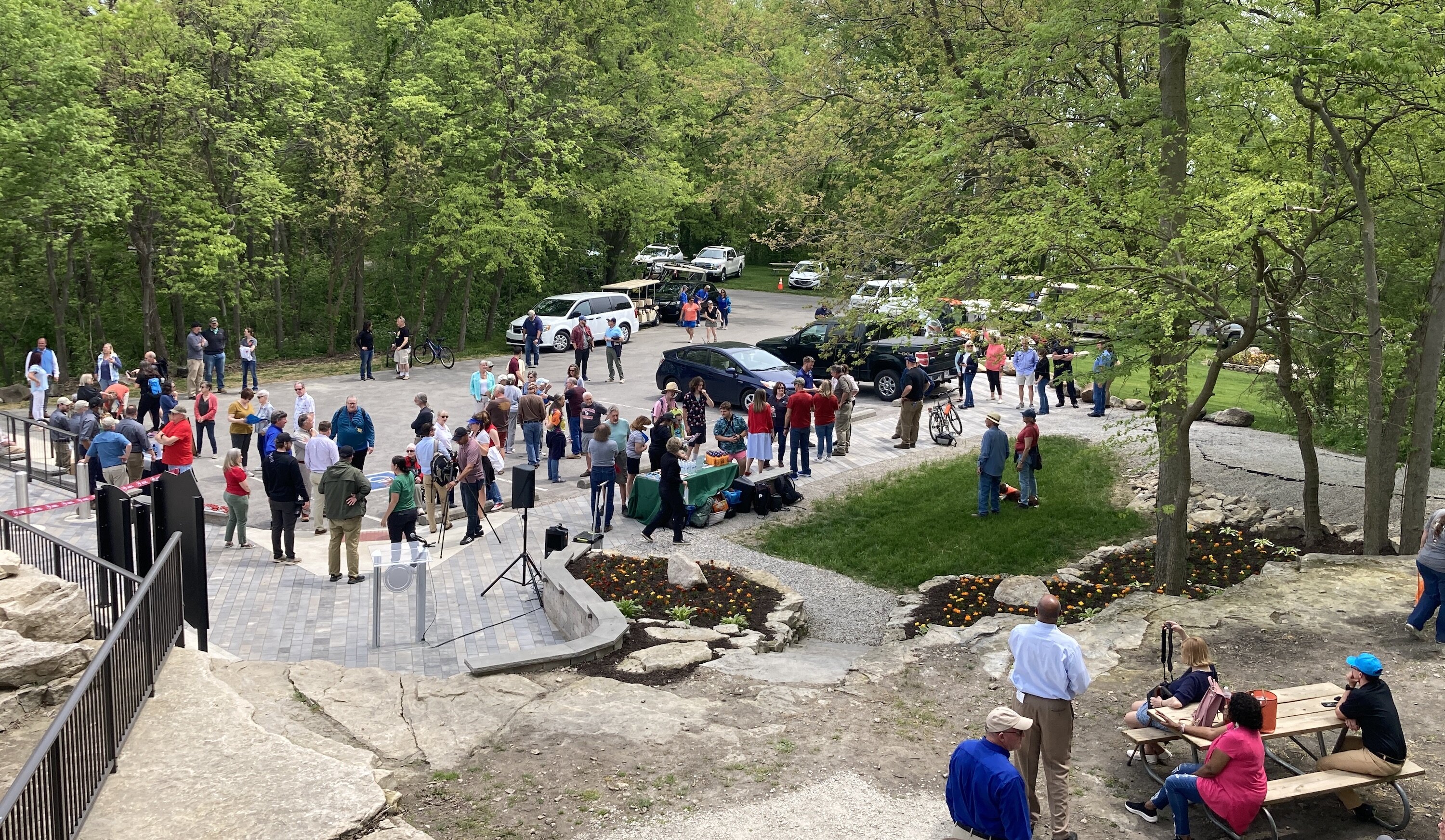 Visitors gather for the Glacial Grooves rededication ceremony May 19.