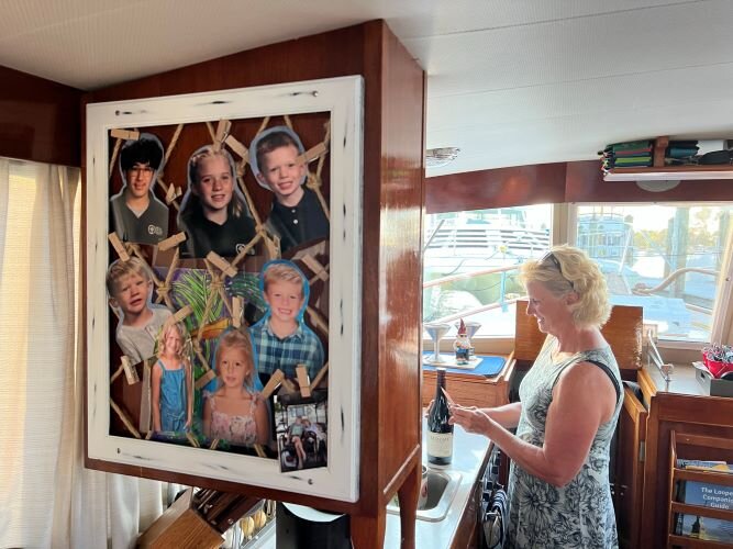 The Browns keep a bulletin board of pictures of their grandkids nearby.