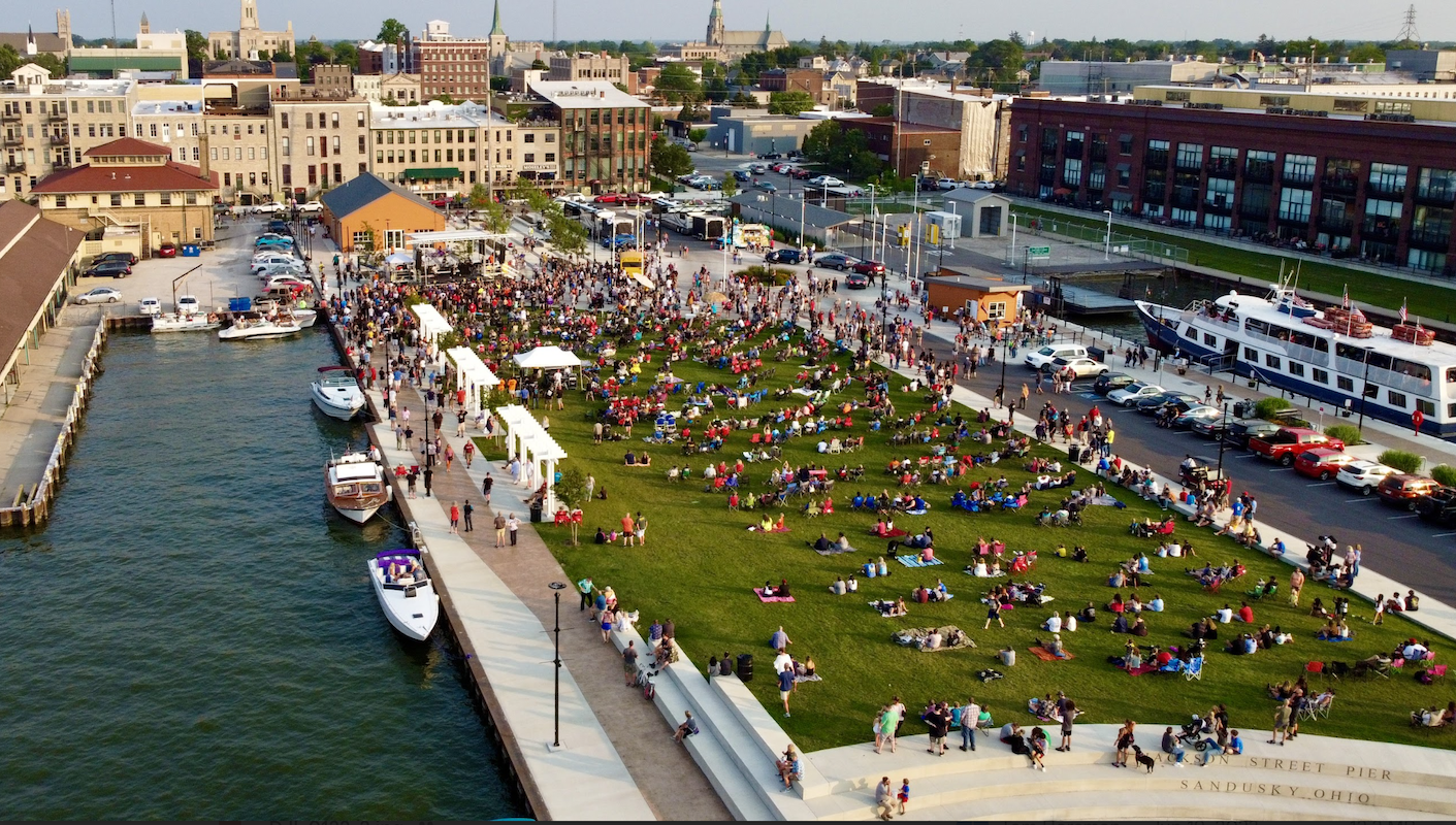 A crowd enjoys a summer day on the Jackson Street Pier.