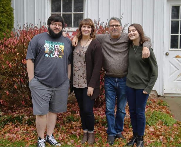 Trent and Sara Beard work at Mr. Smith's with their children, Alex and Lydia.