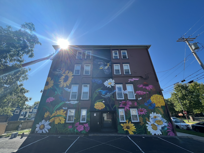 Brennan's mural can be seen on the building at 303 E. Washington St.