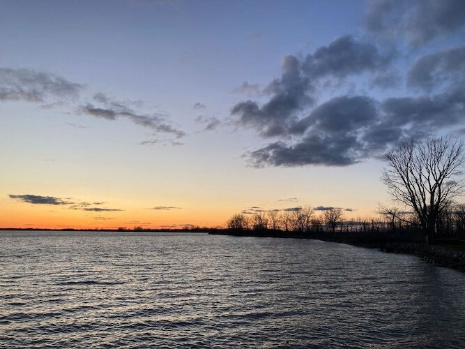 The sun sets over Mud Creek Bay.