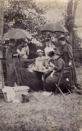 The Jay Cooke family enjoys a rainy picnic at Rattlesnake Island.