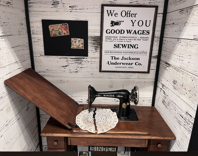 A vintage sewing machine sits in a wall recess at the Marketplace.