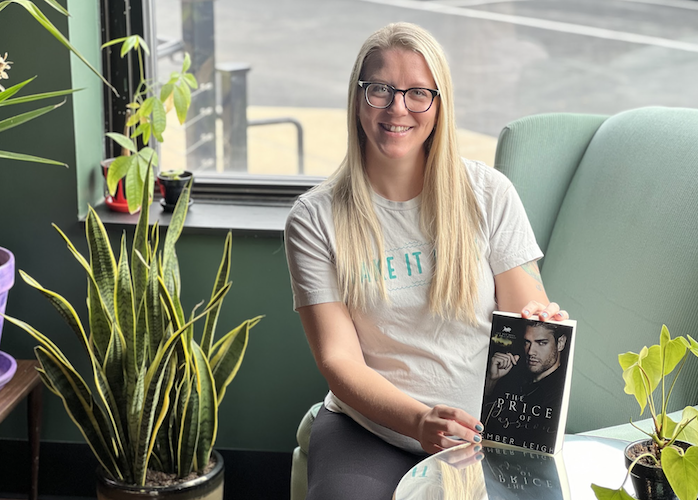 Shannon Bradford, aka Ember Leigh, displays one of her novels at Sandusky Book Bar.