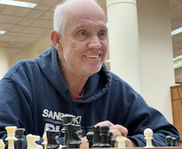 Sherwood teaches an opponent during a "Chess with Paul Sherwood" session at the Huron Library.