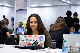 A Girls Who Code student participates in a workshop