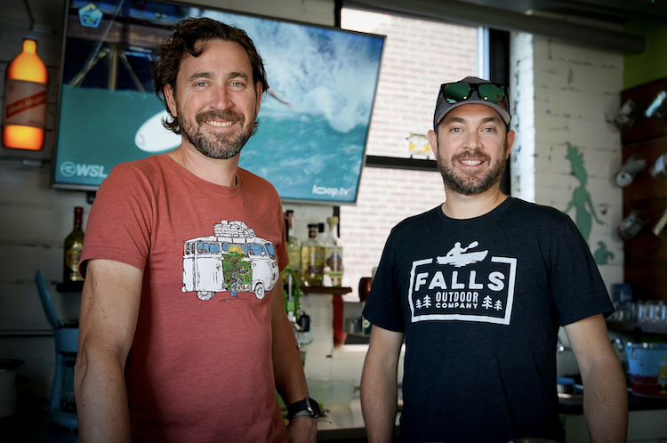 Ryan and Chad Whaley stand behind the bar at Paddle Bar.