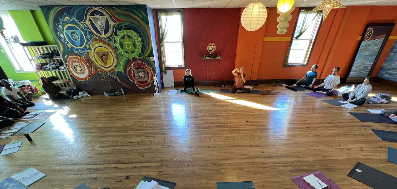 Brian Henderson and Shannon Thomas lead a Yoga Instructor Program class at Open Way Yoga in Huron in November.